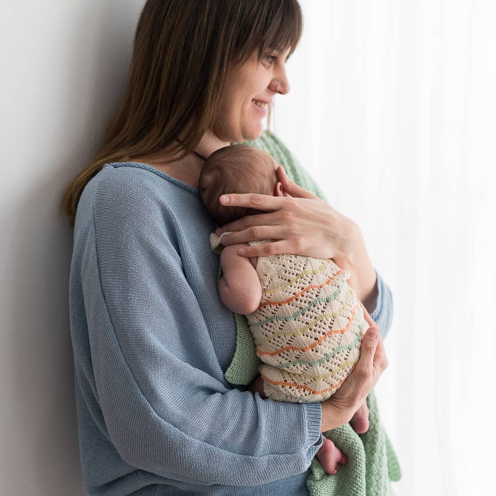 Knitted romper in lace pattern - organic